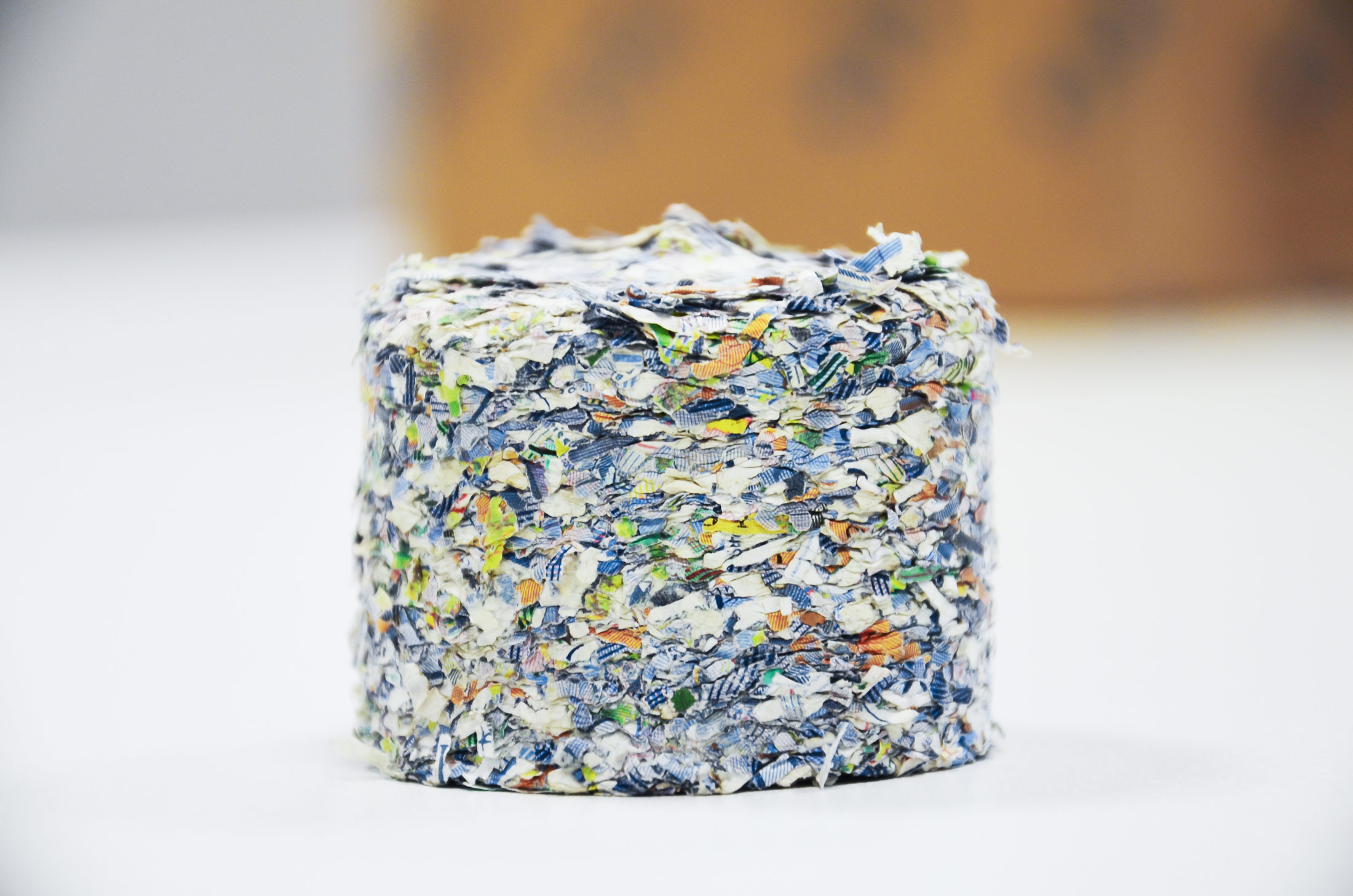 Round briquette of banknotes paper