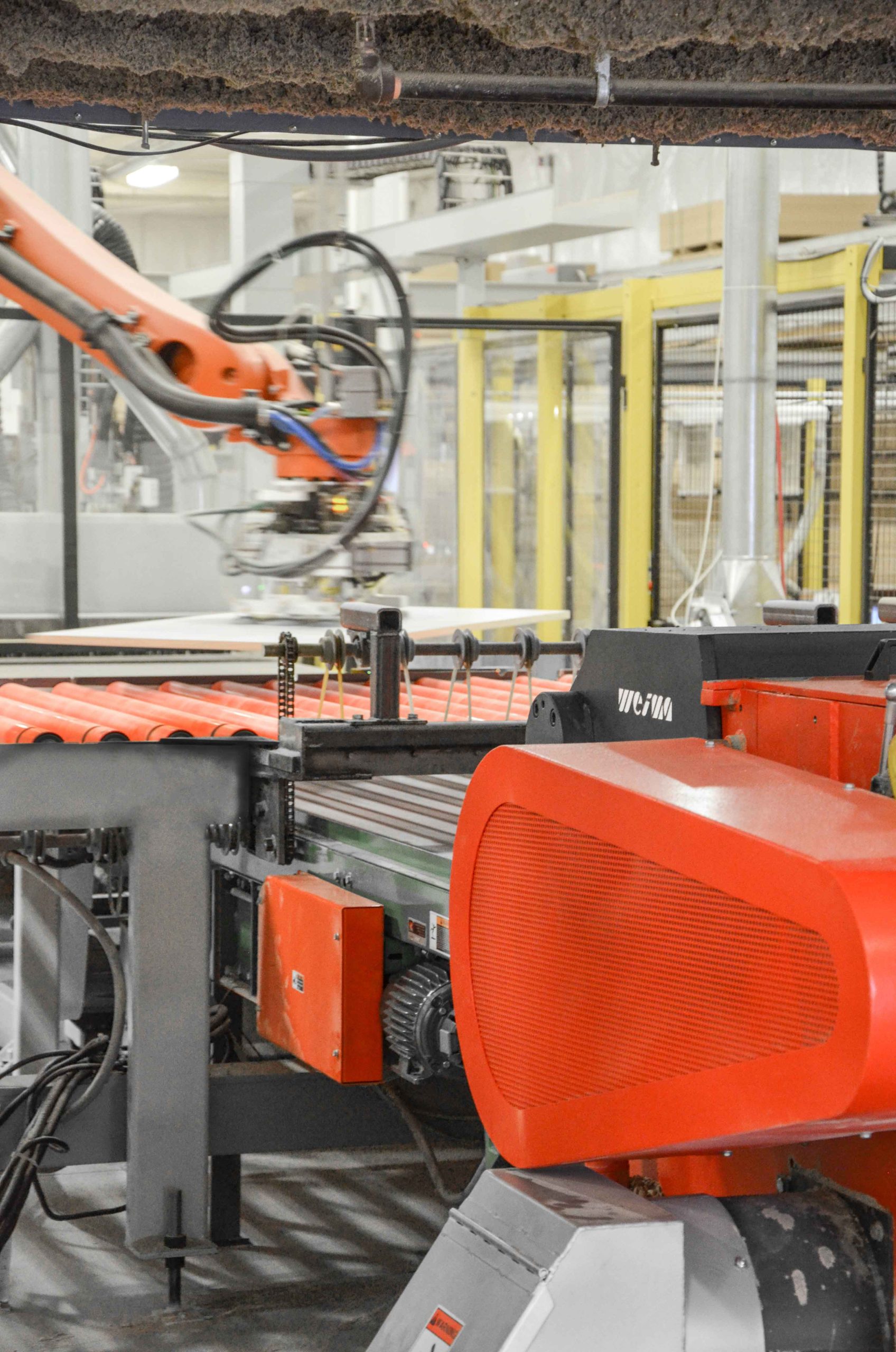 Wood waste from CNC milling is shredded in WEIMA horizontal shredder.