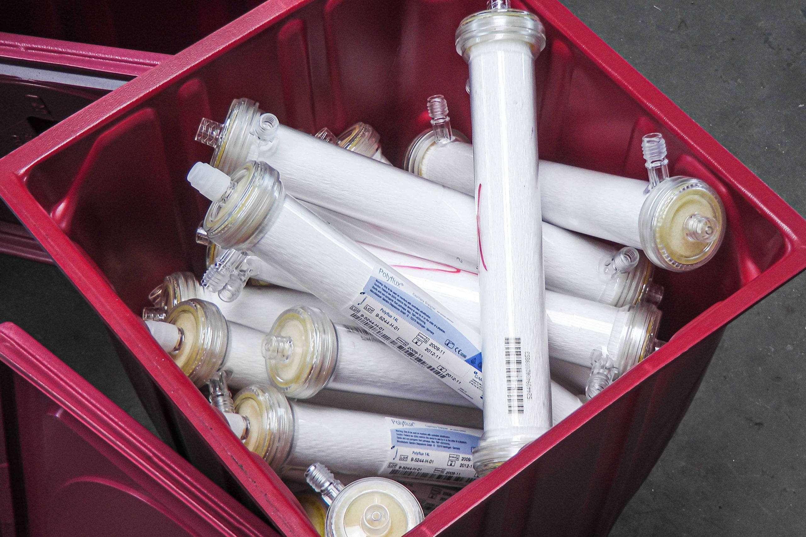 A red box full of glass filter ampoules