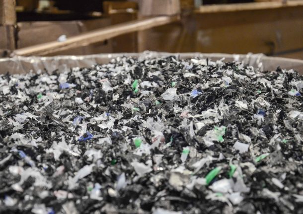 Shredded PVC film in mixed colors as regrind after an industrial recycling process