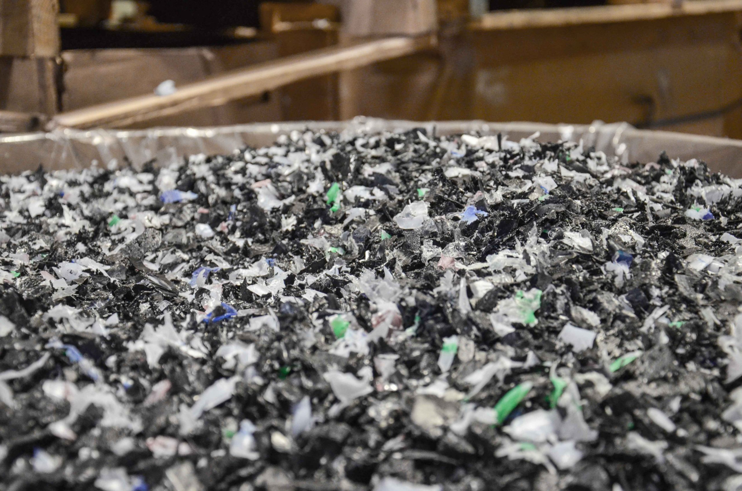 Shredded PVC film in mixed colors as regrind after an industrial recycling process