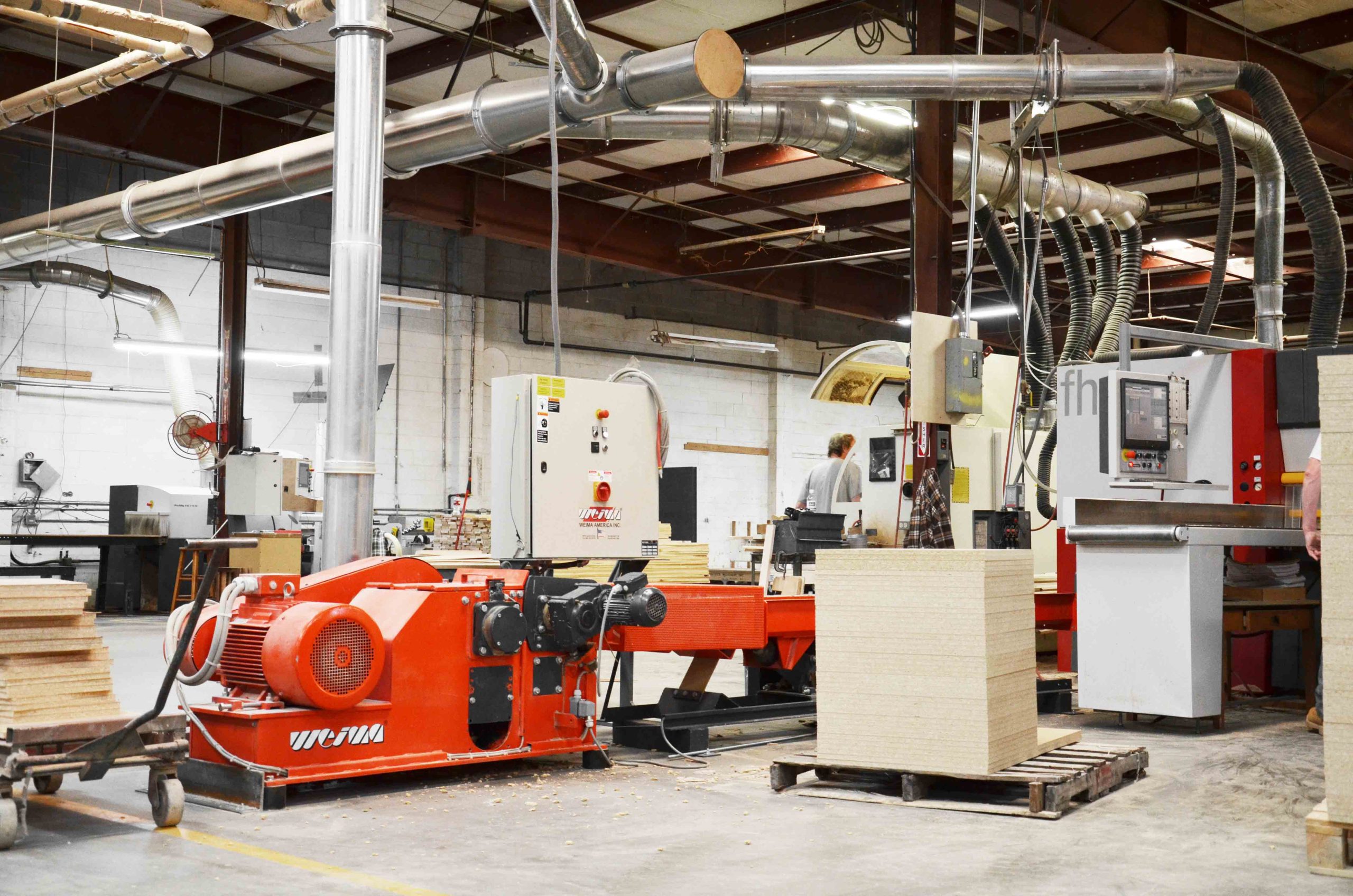 Chipboard is shredded with WEIMA horizontal shredder