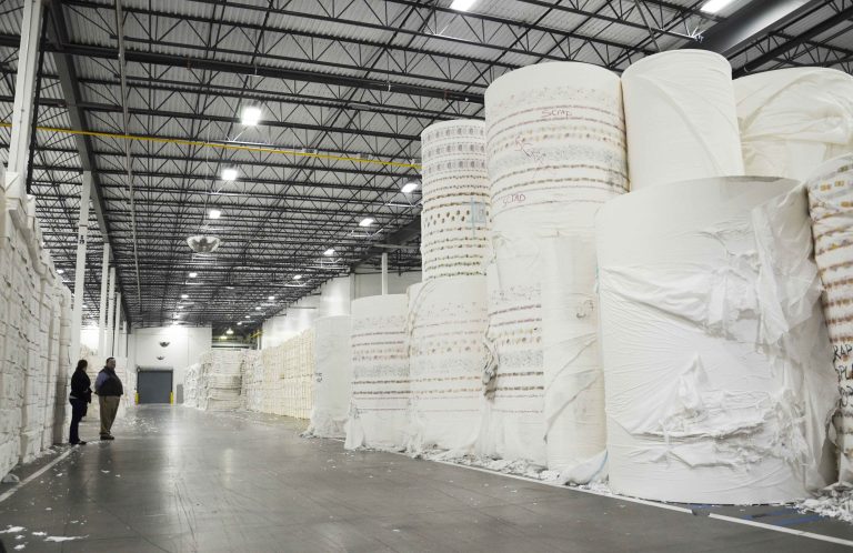 Huge paper rolls before shredding