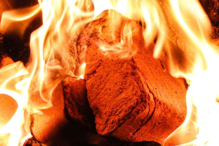 rectangular briquettes burning in a fire oven