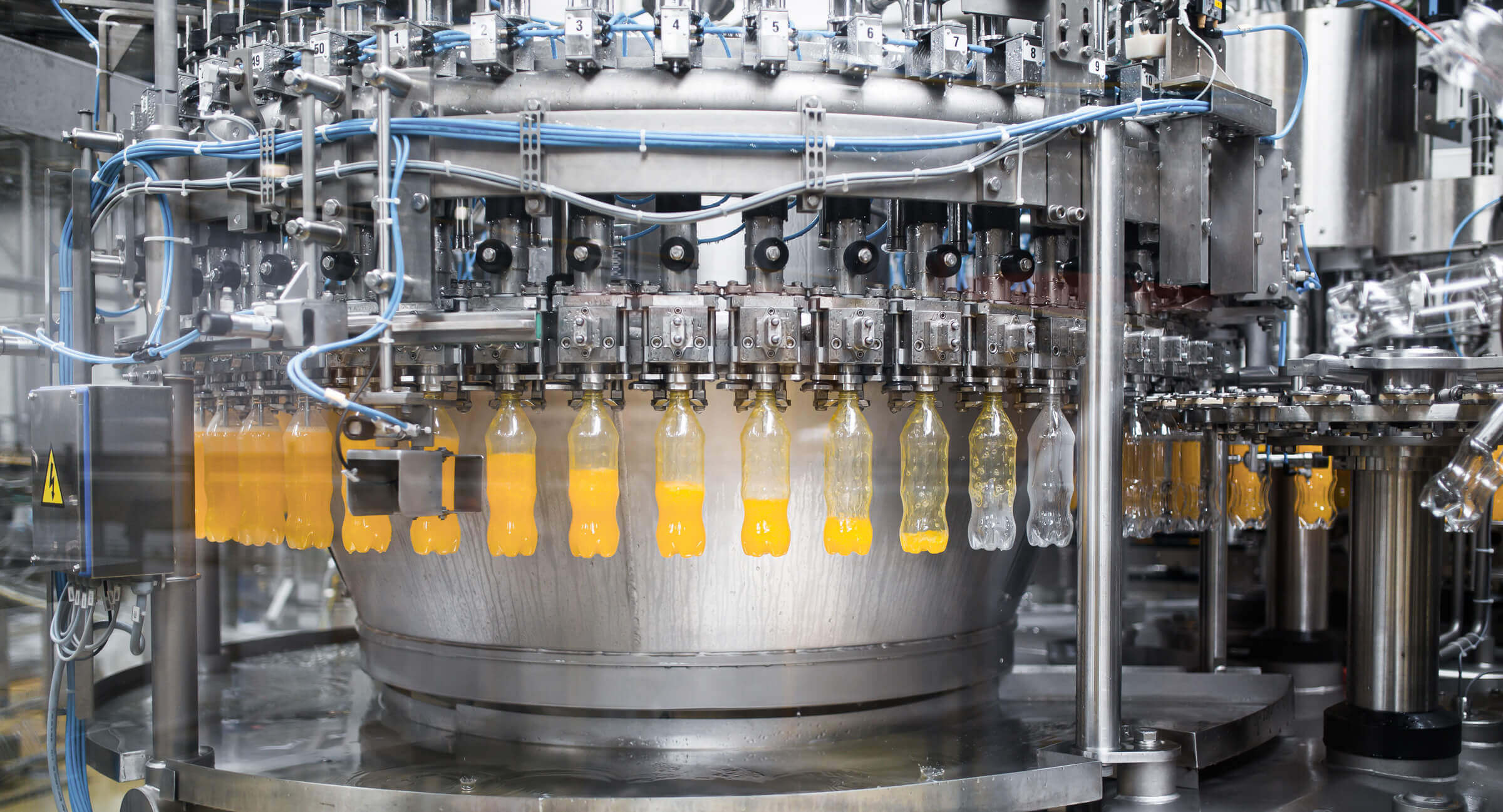 Filling of plastic bottles during production