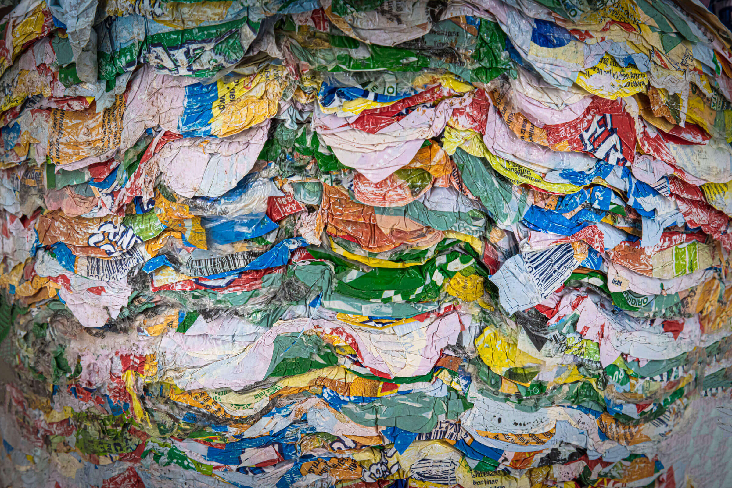 Compacted labels from beverage bottles
