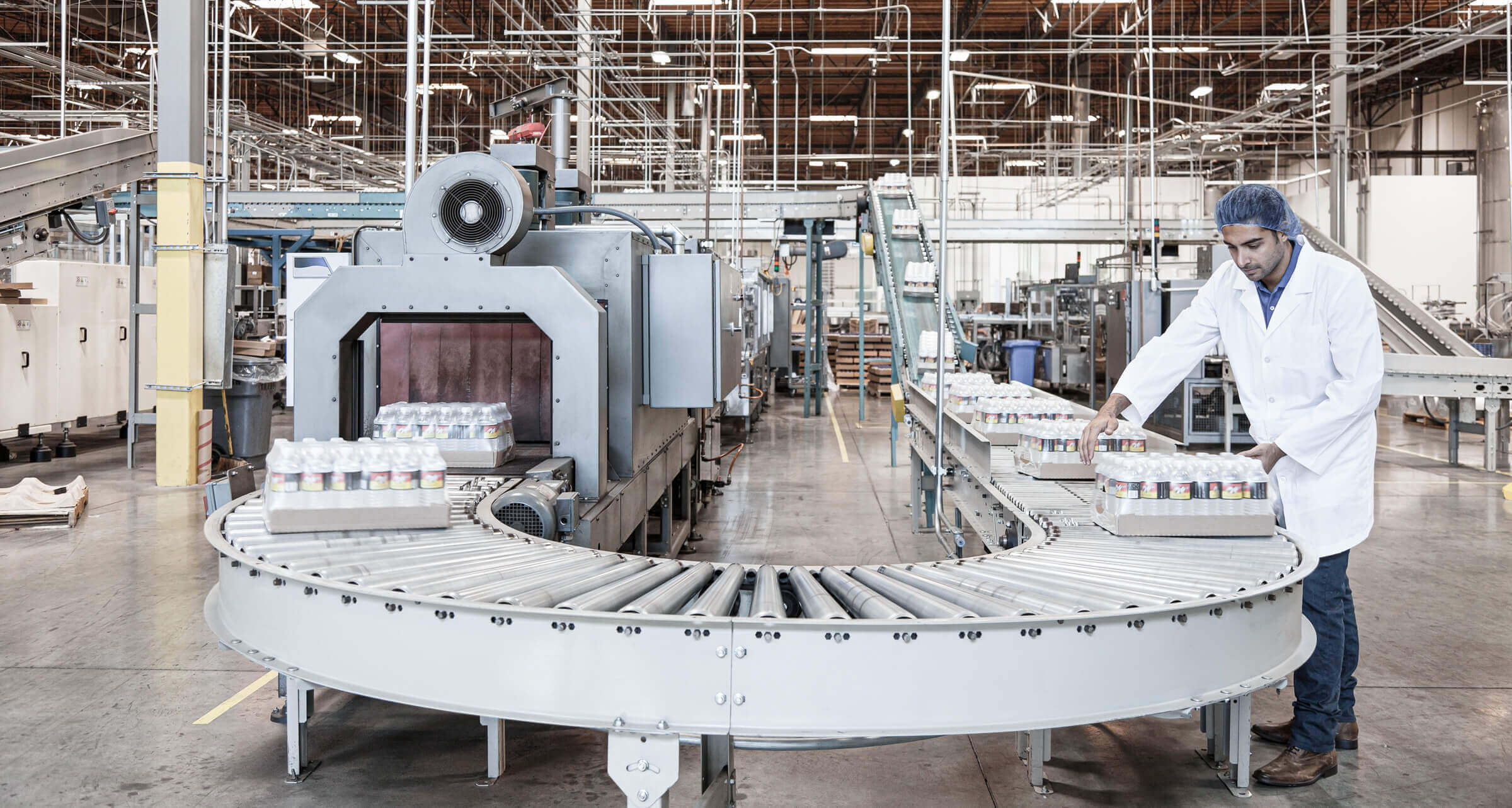 Packaging of water bottles in production line