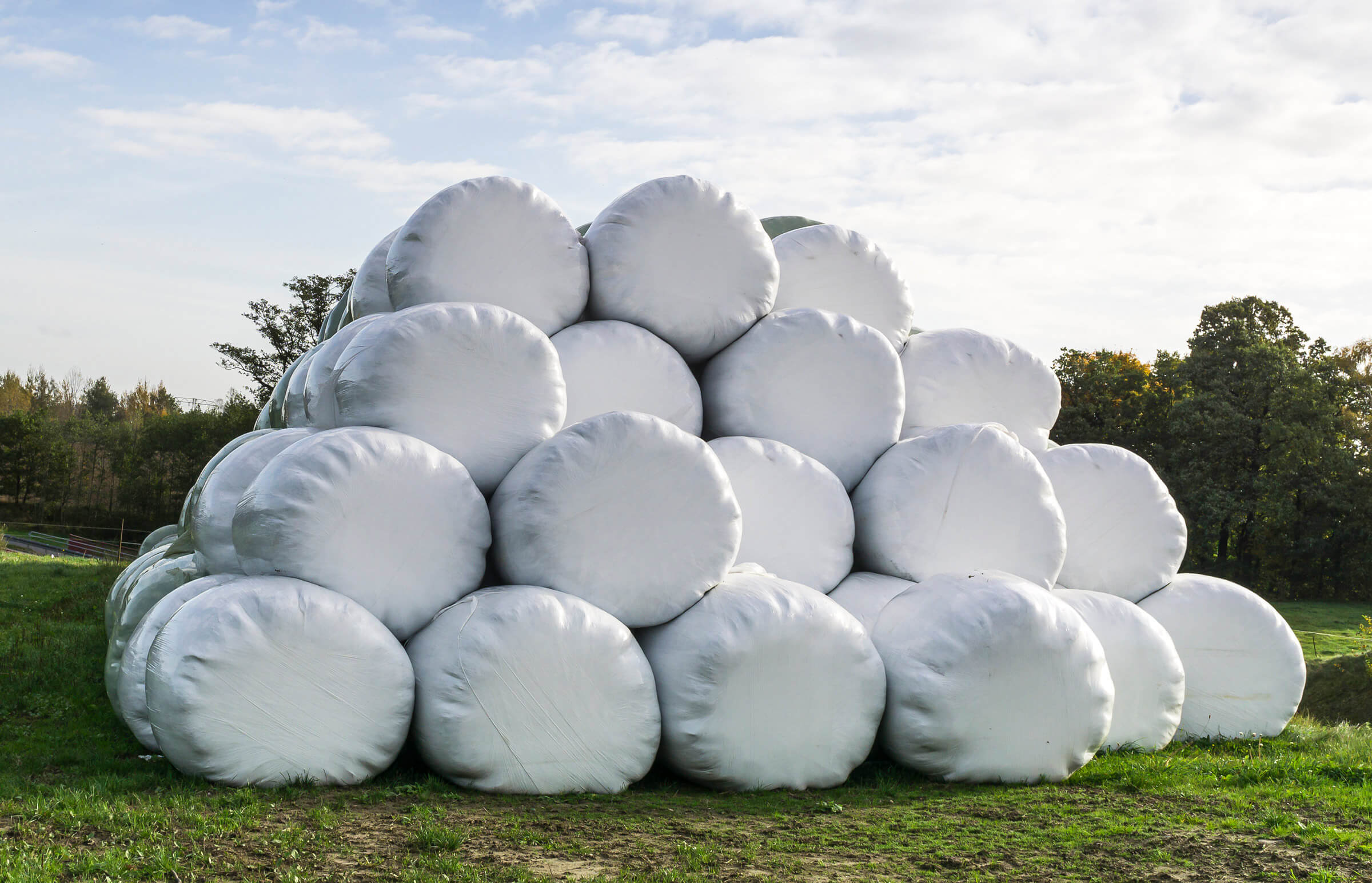 Pile with wrapping film bales on the field for feed production
