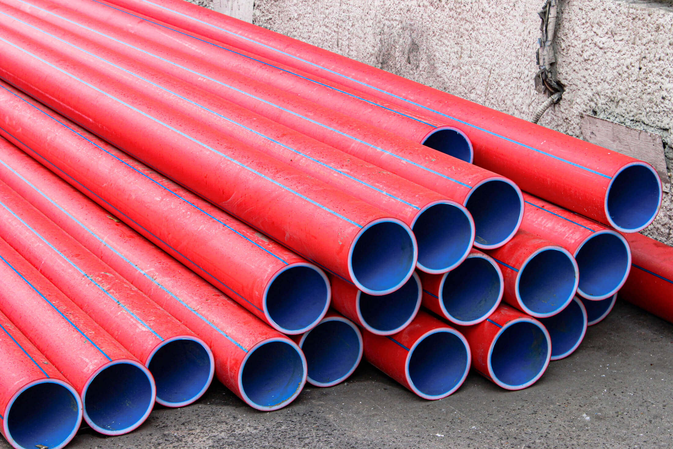 Multicolored PE-HD pipe cuttings are stacked for storage