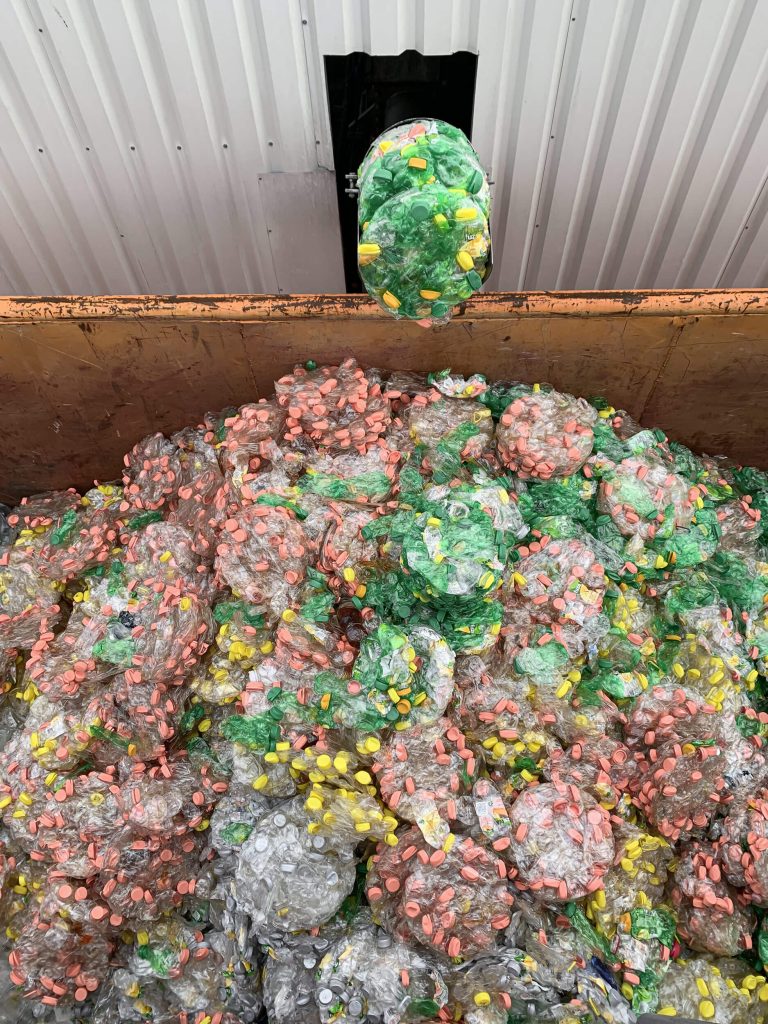 WEIMA PUEHLER press discharges pressed discs from PET bottles into containers