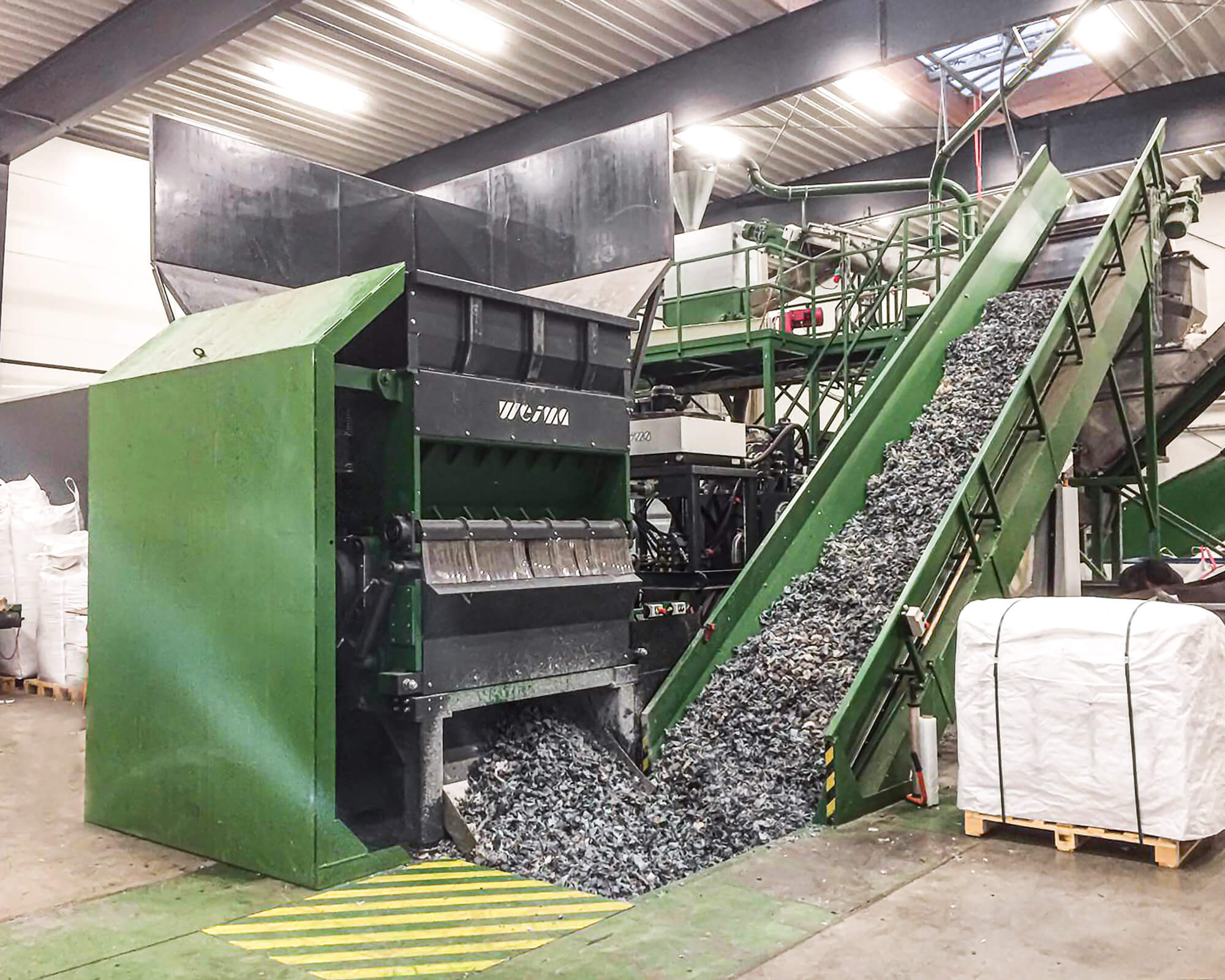 Post-consumer plastic waste shredding Denmark with WEIMA shredders