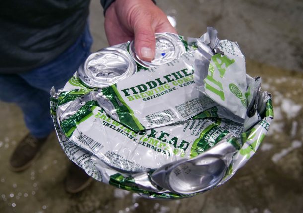 The aluminum cans are pressed into discs with a diameter of 200 mm
