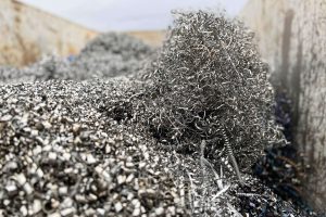Voluminous pile of metal chips in a container