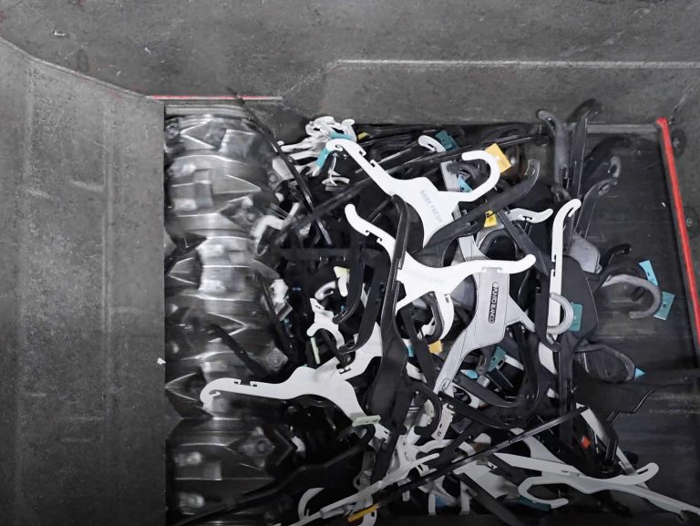 view in side shredder with rotor and clothes hangers
