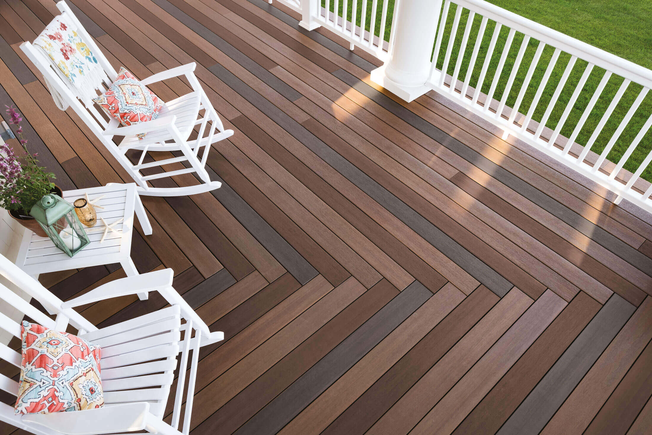 multi-colored porch floor with white rocking chairs