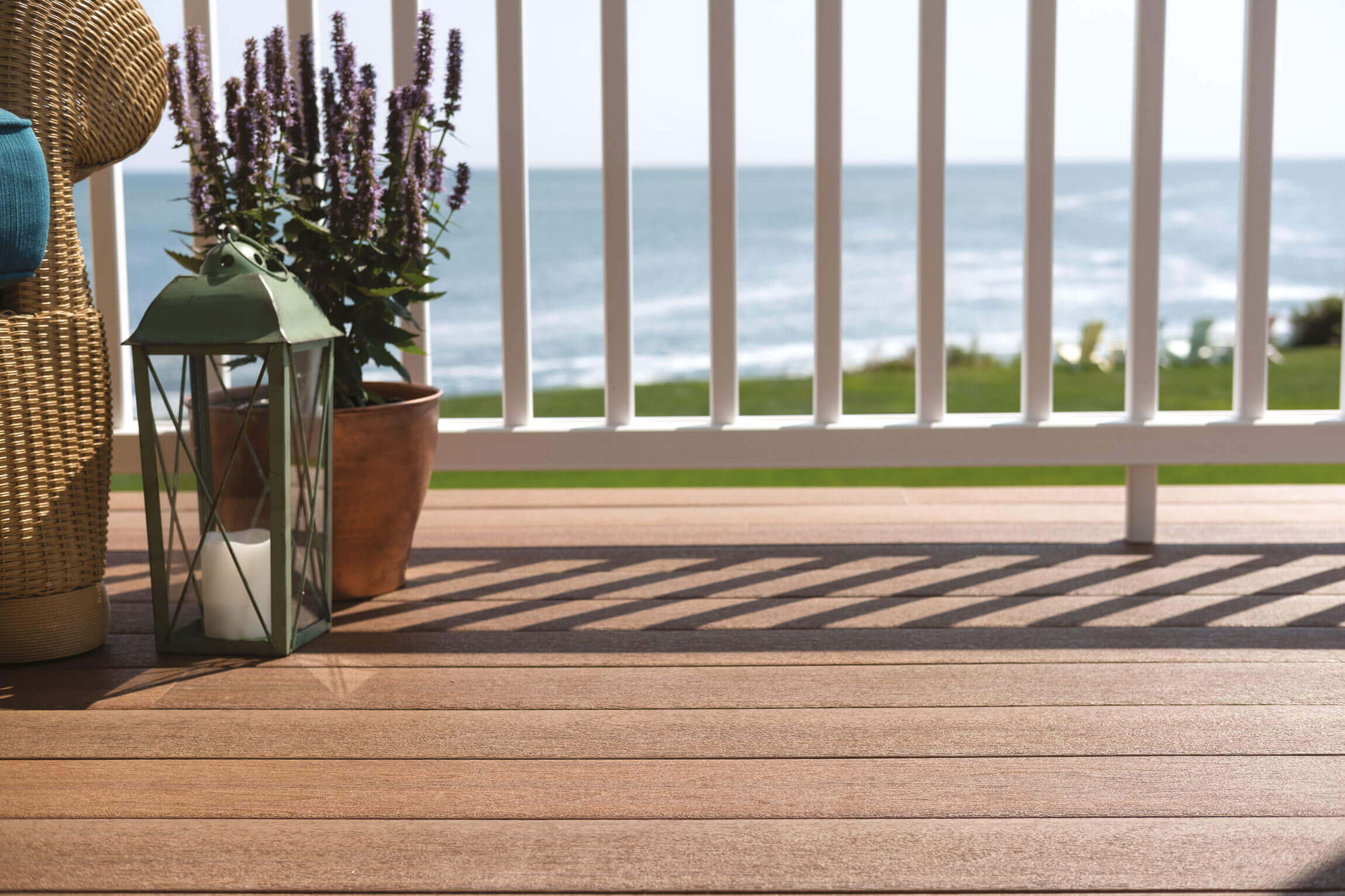 The view from a porch made of composite materials overlooking a beach.