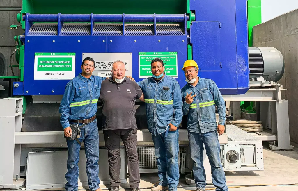 four persons in front of a weima shredder in mexico