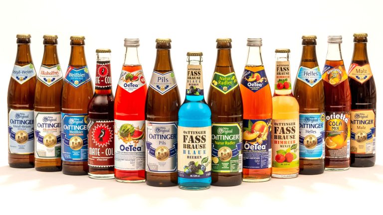 13 different glass bottles from oetttinger brewery