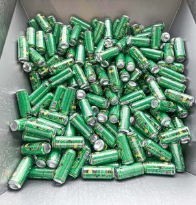 green oettinger beer cans in a container