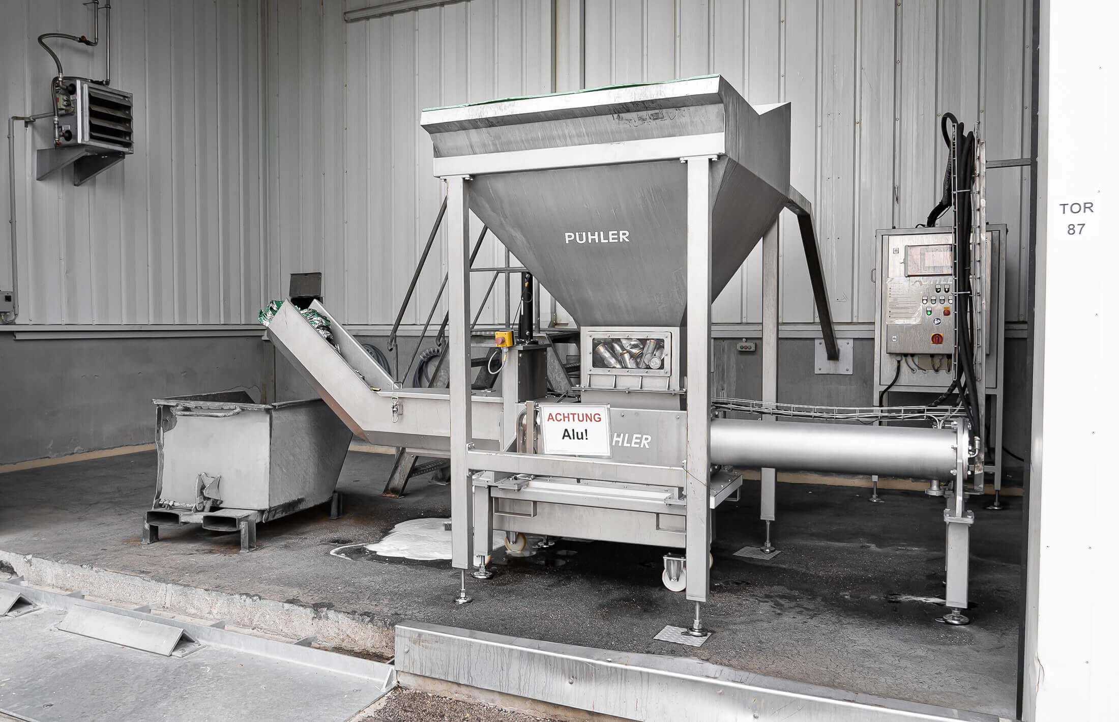 stainless steel weima puehler drainage press inside a production hall