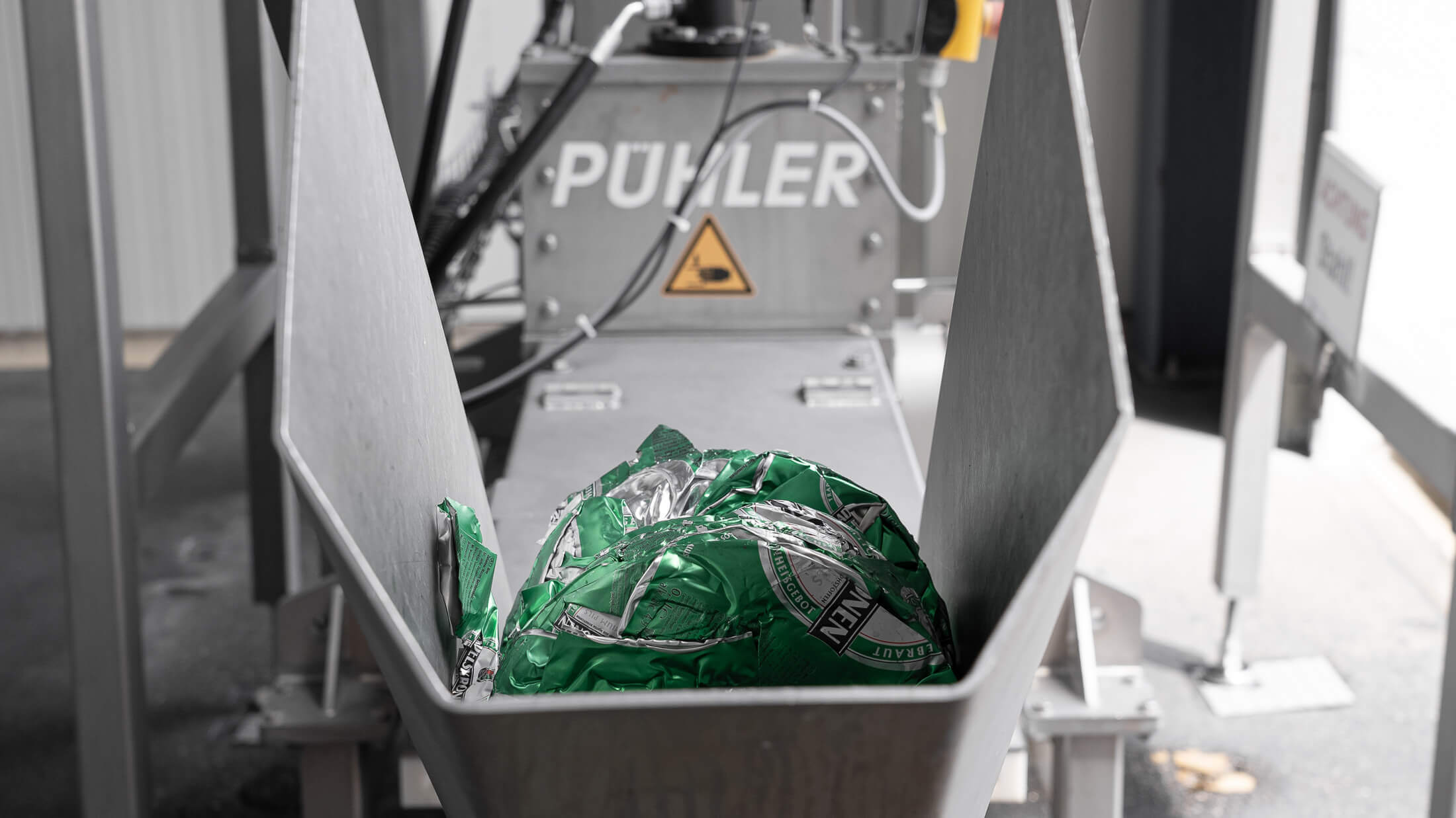 oettinger beer cans compressed on puehler press discharge pipe