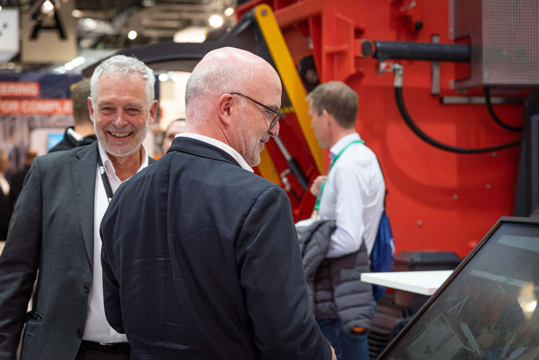 martin friz and two weima employees on WEIMA trade show booth