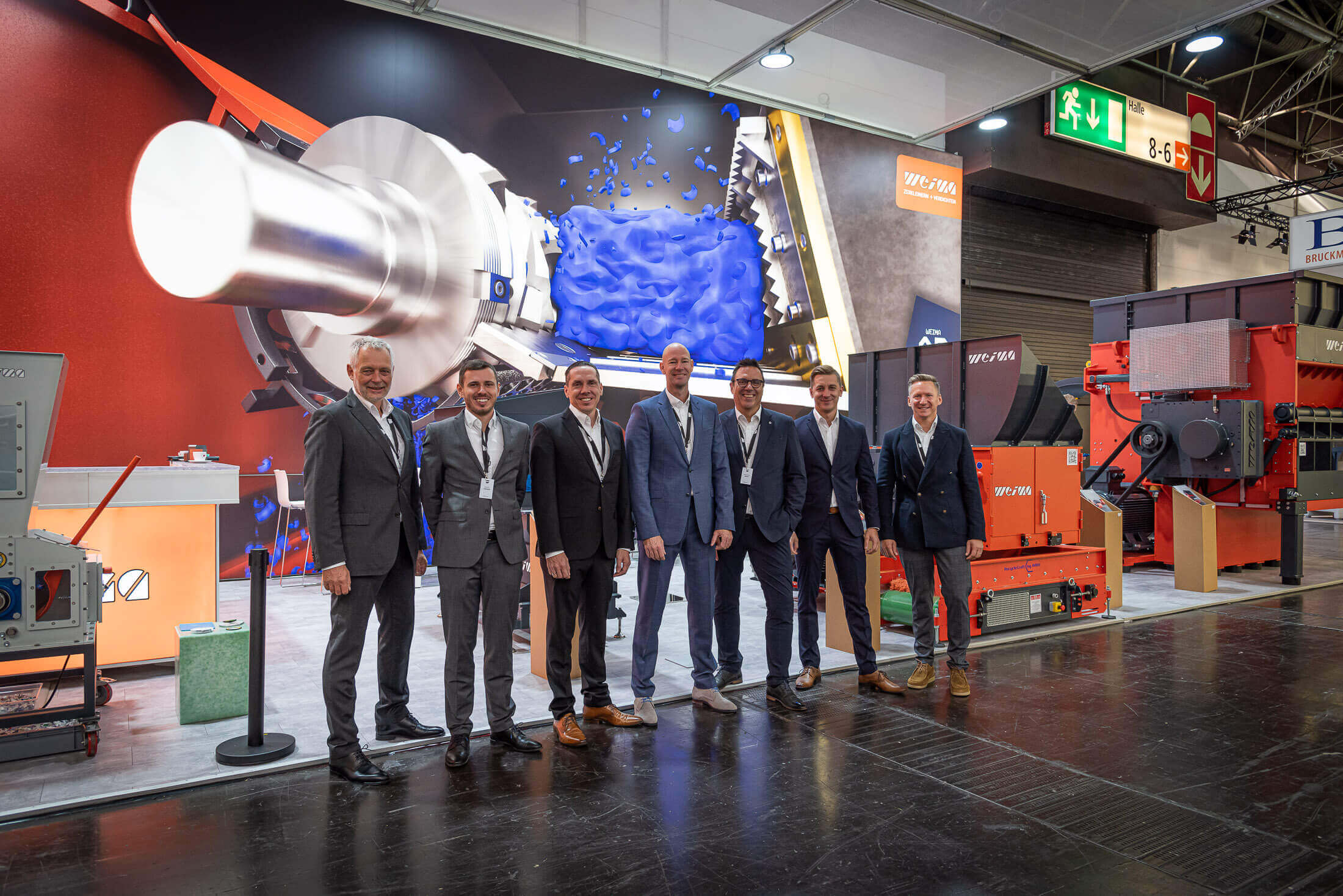 seven weima employees in front of the weima k show booth