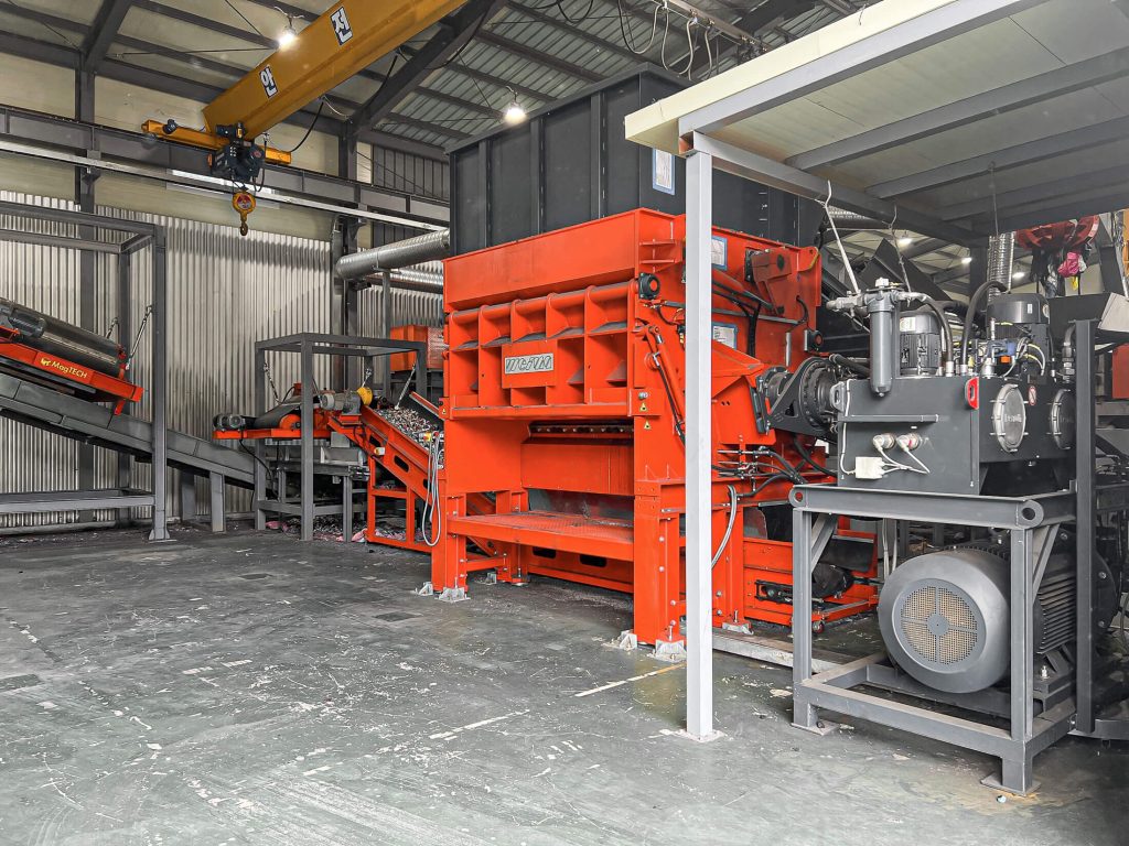 orange weima shredder with conveyor belts and hydraulic drive power pack in south korea