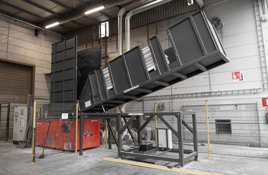 orange WEIMA WLK 1500 shredder with a tilting table at Unilin in Belgium