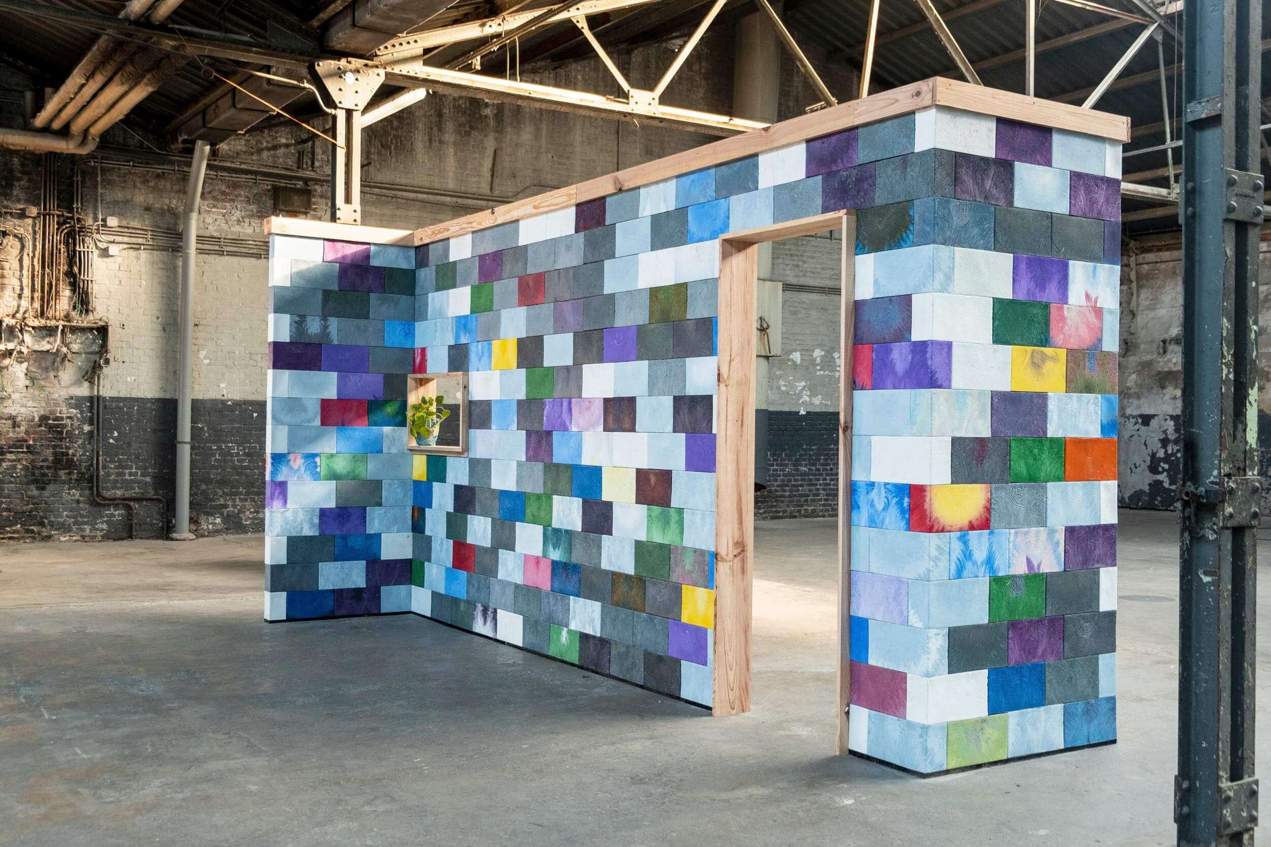 wall made of recycled plastic scrap, Credit: Precious Plastic