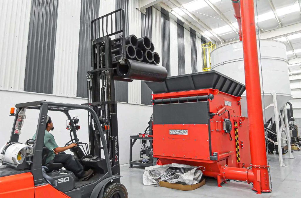 weima shredder filled by forklift with hdpe pipe offcuts