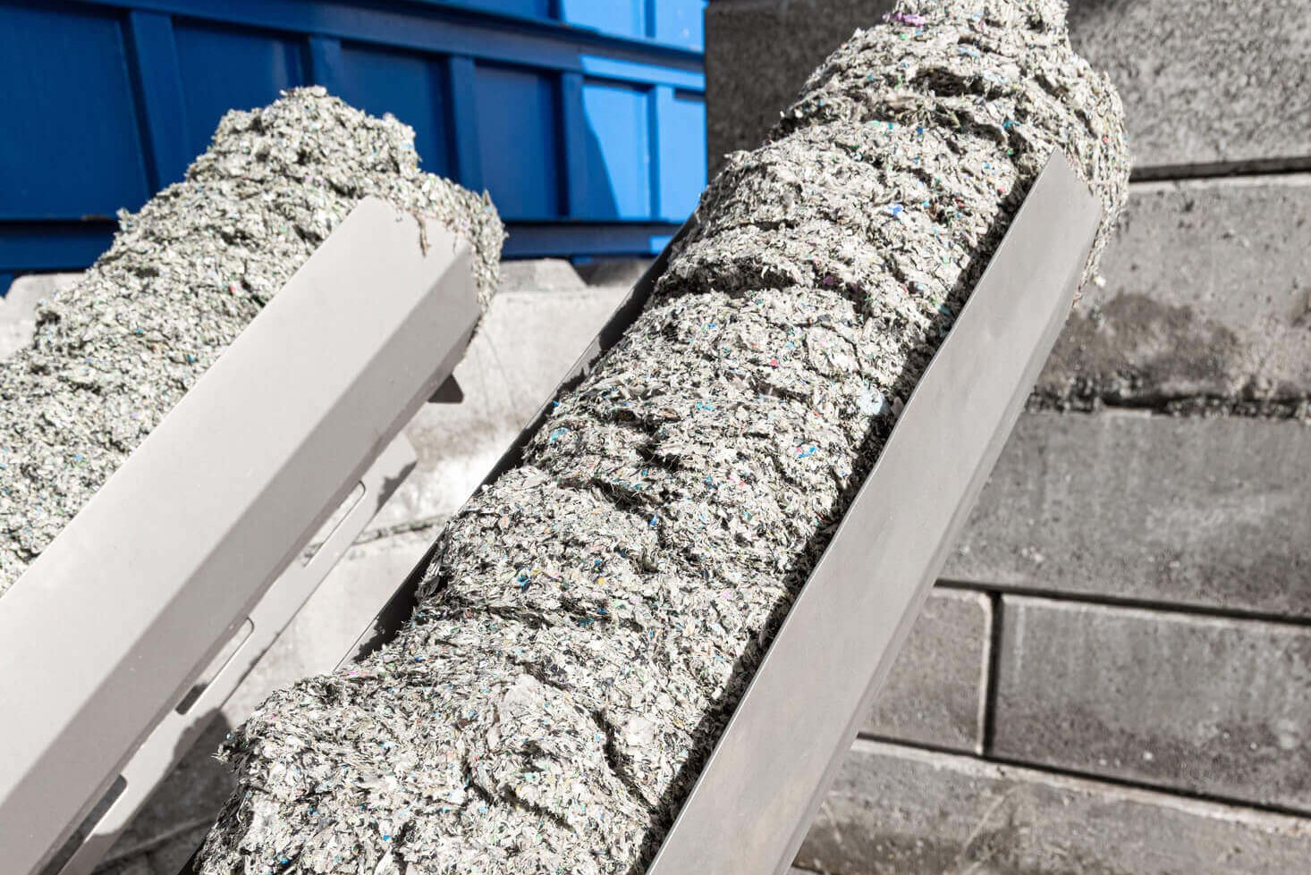 drained and compressed plastic rejects on discharge pipes