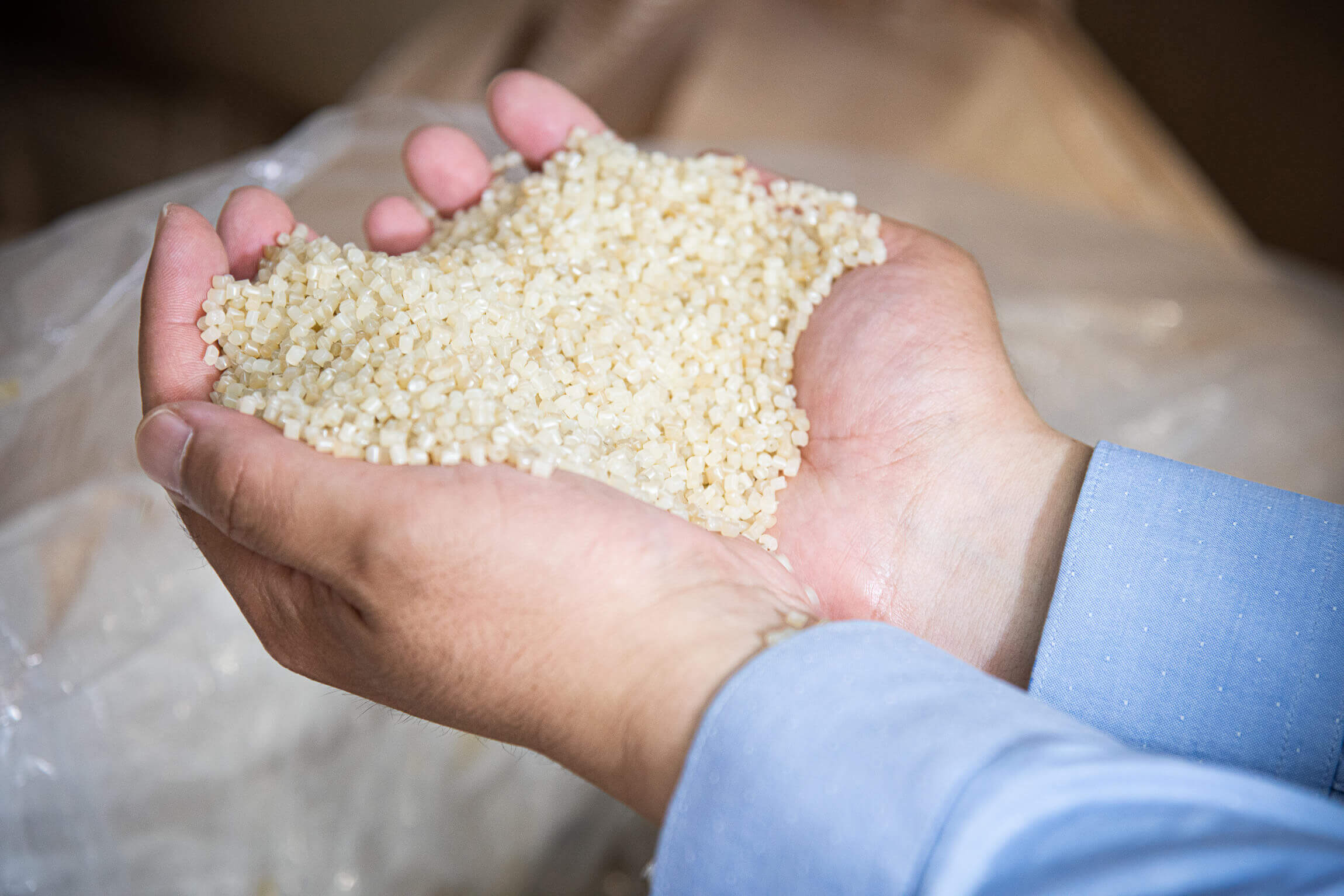 white nylon pellets inside hands