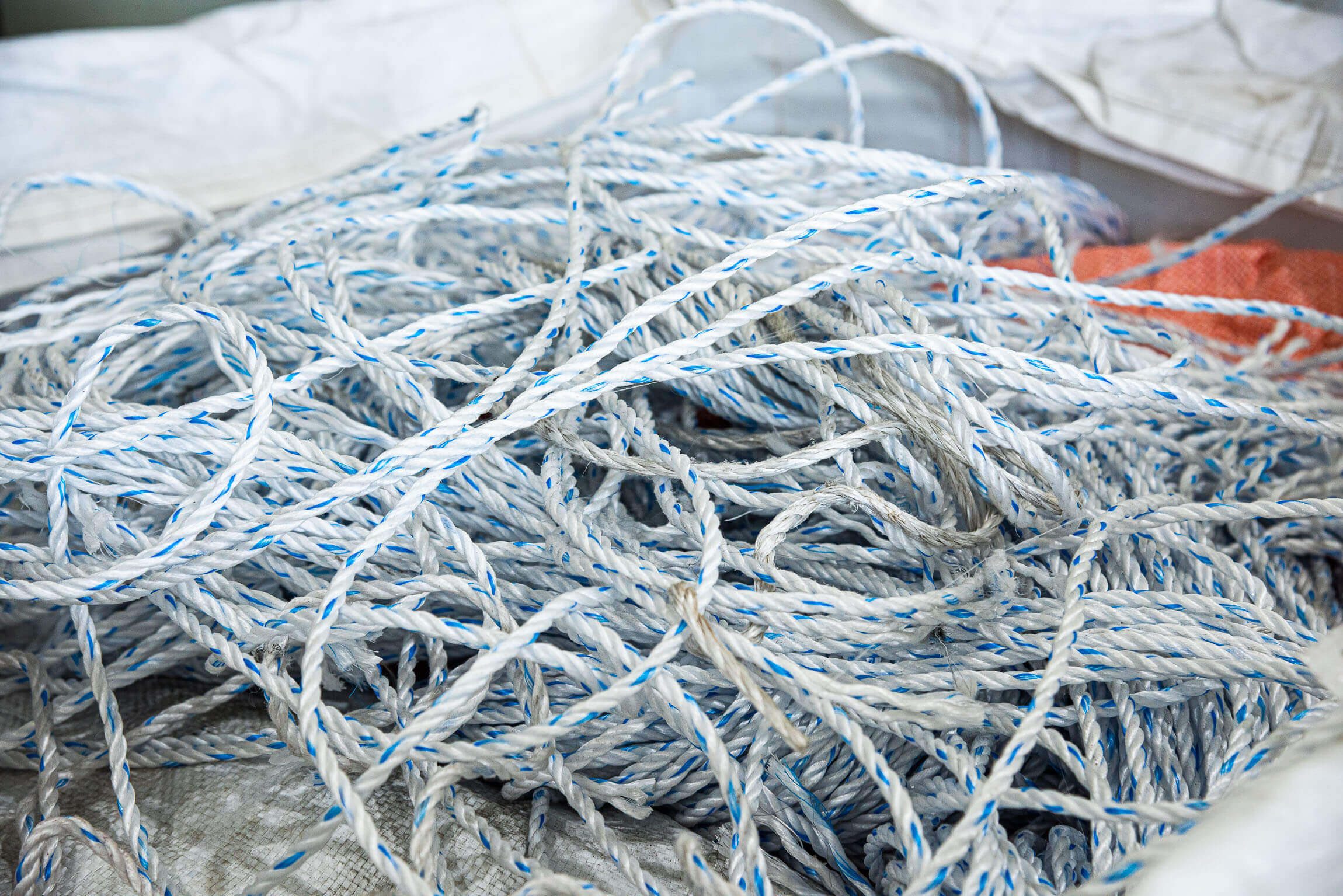 white and blue ocean ropes inside a big bag