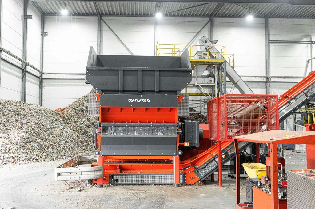 an orange WEIMA shredder W5.18 at a plastics recycler in the Netherlands