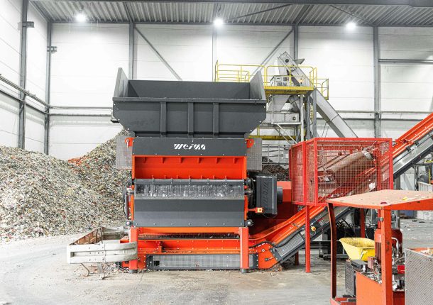 an orange WEIMA shredder W5.18 at a plastics recycler in the Netherlands