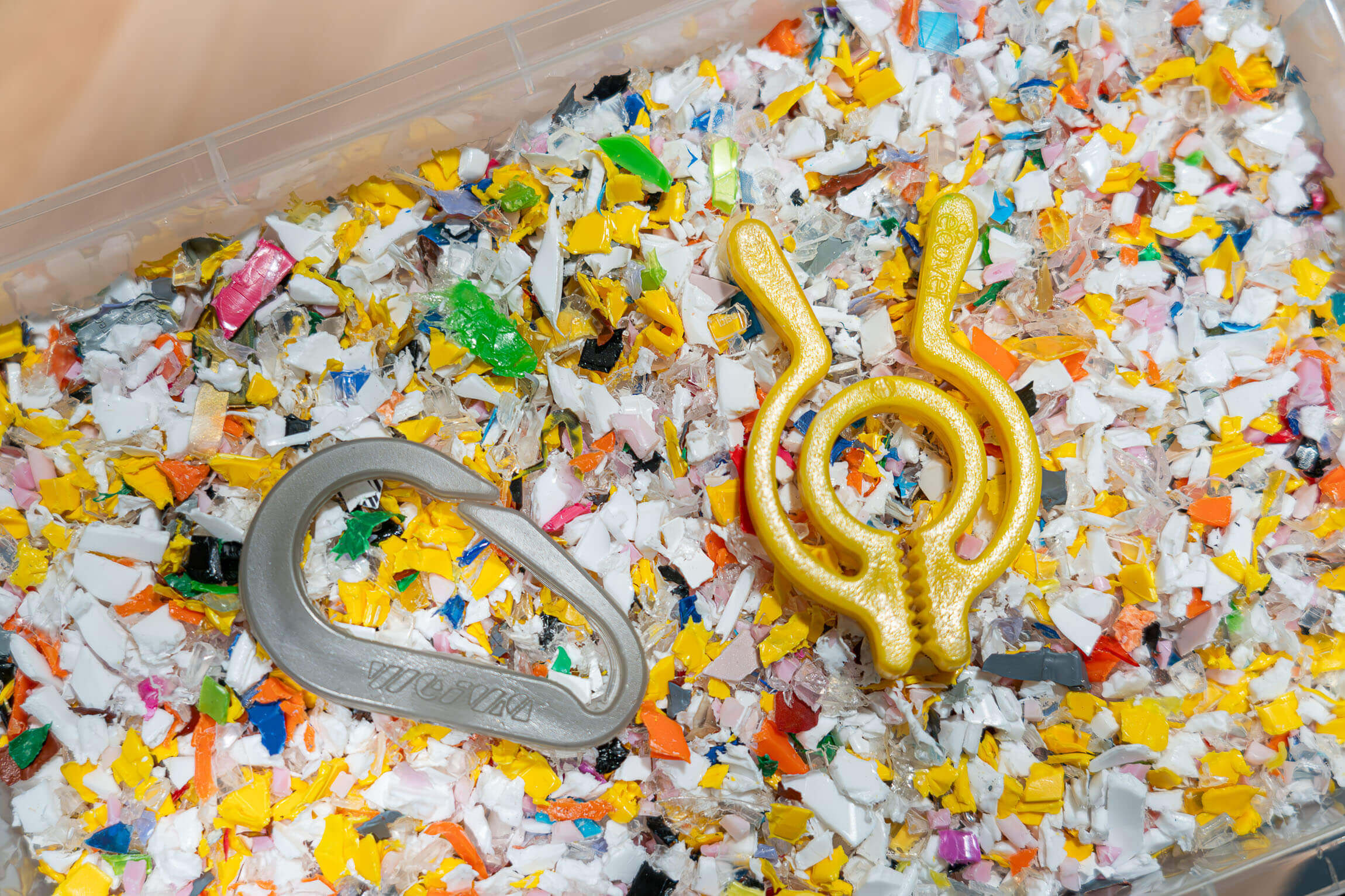 yellow Shredded PP plastics and carabiner