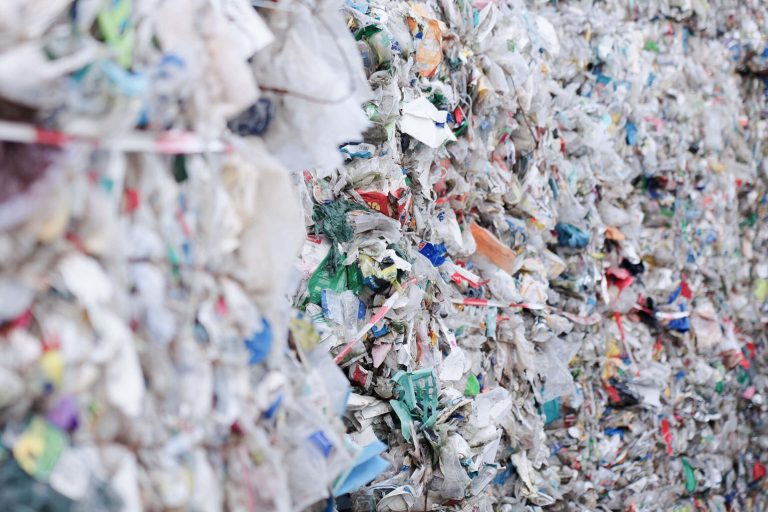 A lot of colorful post-consumer plastic with blurred foreground