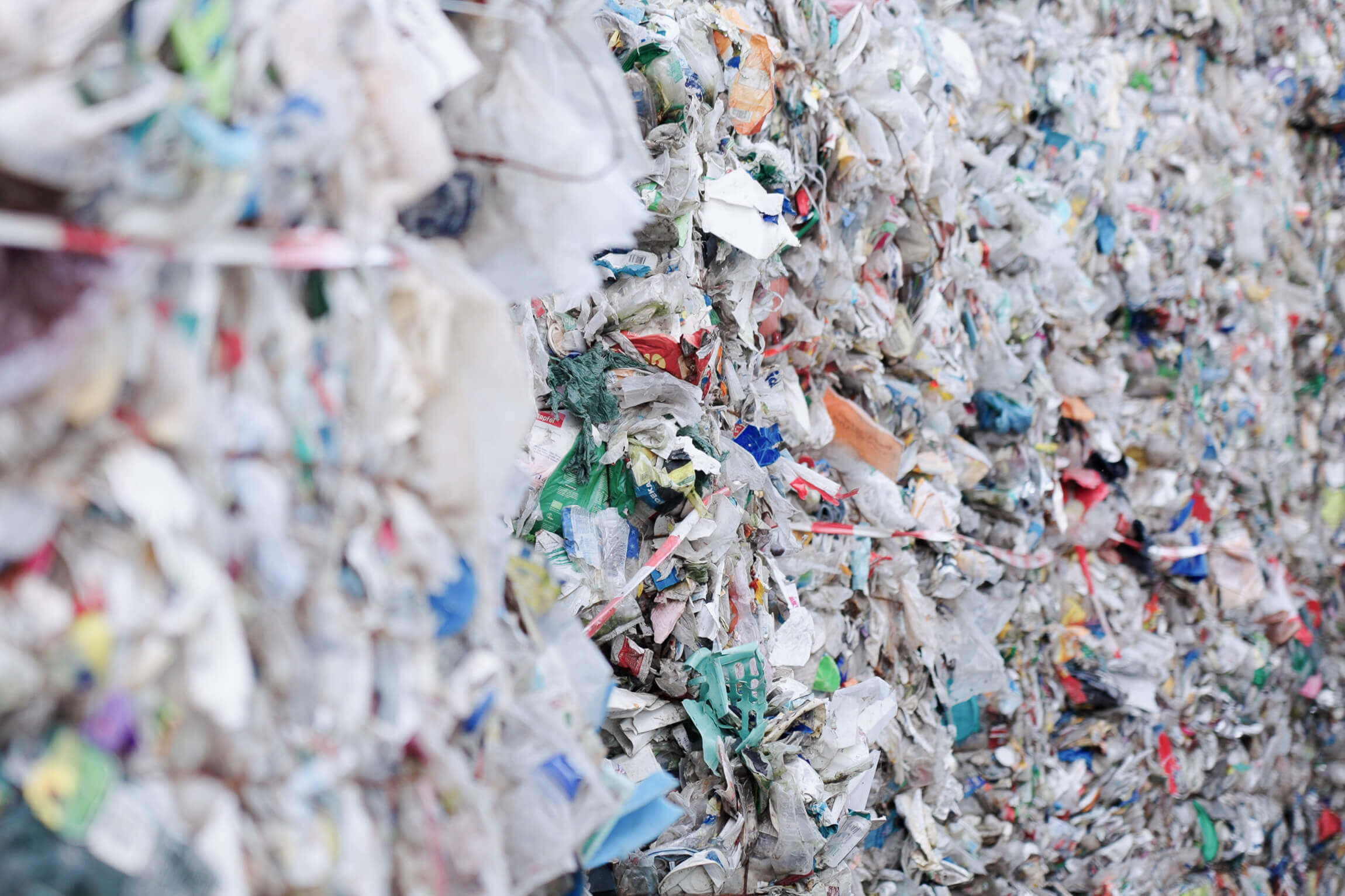 A lot of colorful post-consumer plastic with blurred foreground