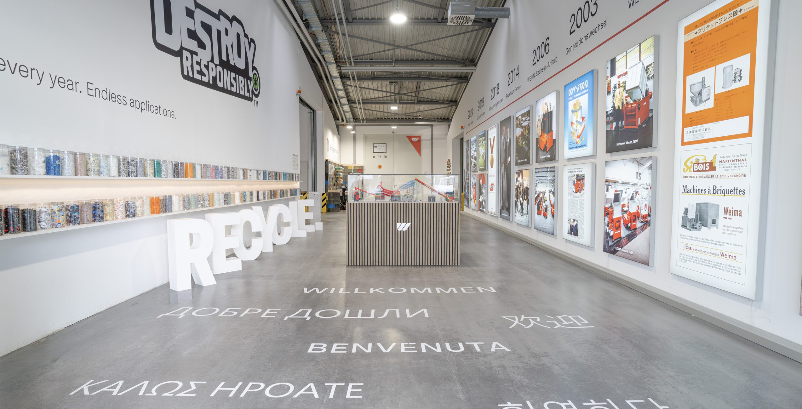 WEIMA entrance with material samples and history timeline