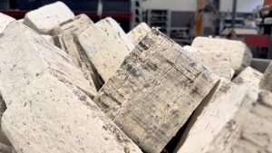 A stack of white, square PU foam briquettes.